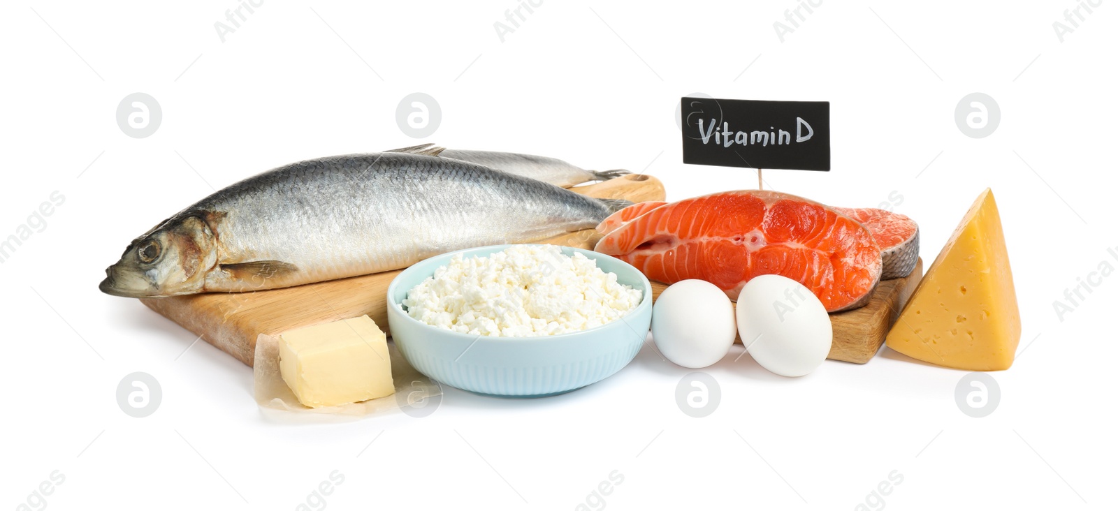 Photo of Fresh products rich in vitamin D on white background