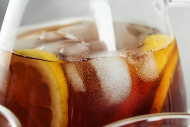 Photo of Glassware of delicious refreshing iced tea, closeup