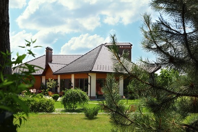 Photo of Modern house and beautiful garden on sunny day