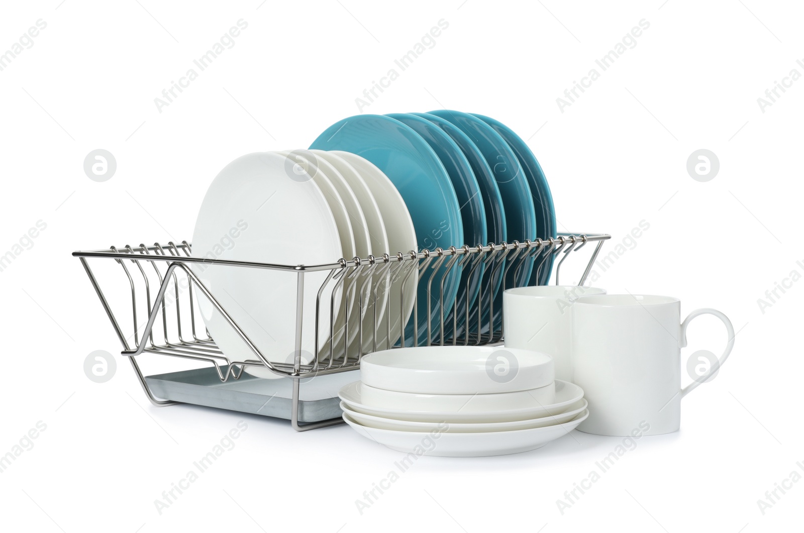 Photo of Rack with dishes and clean tableware on white background