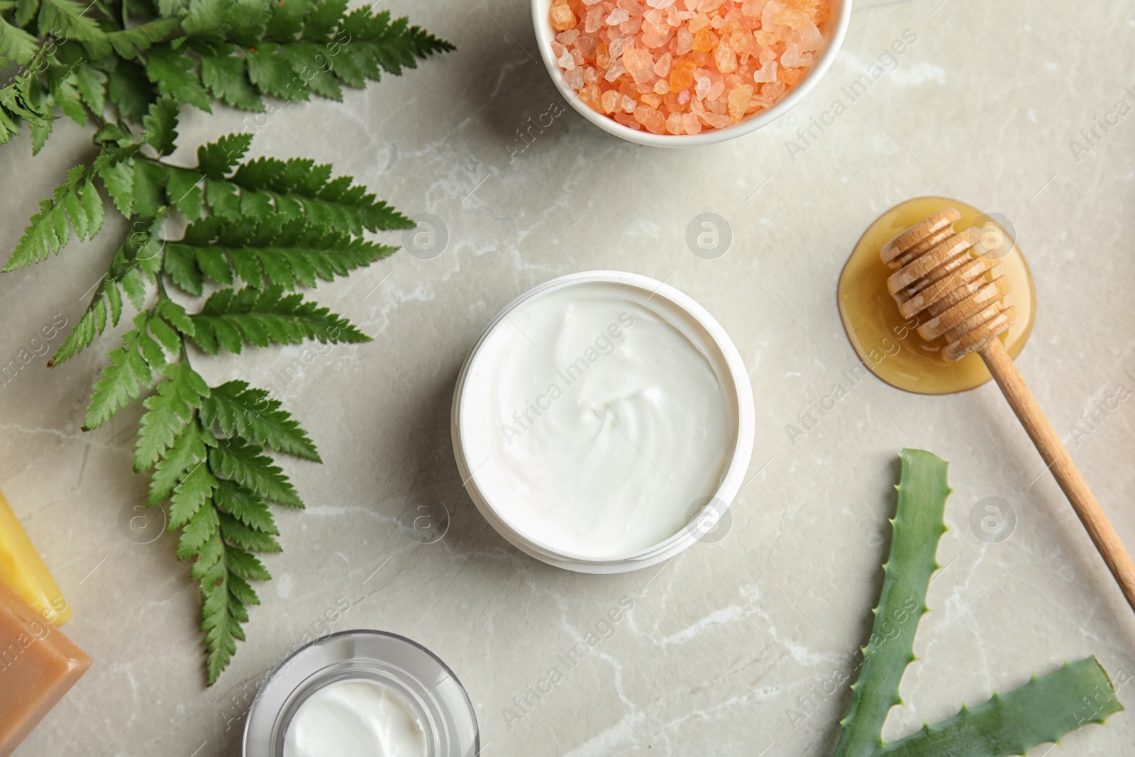 Photo of Flat lay composition with different body care products on grey background