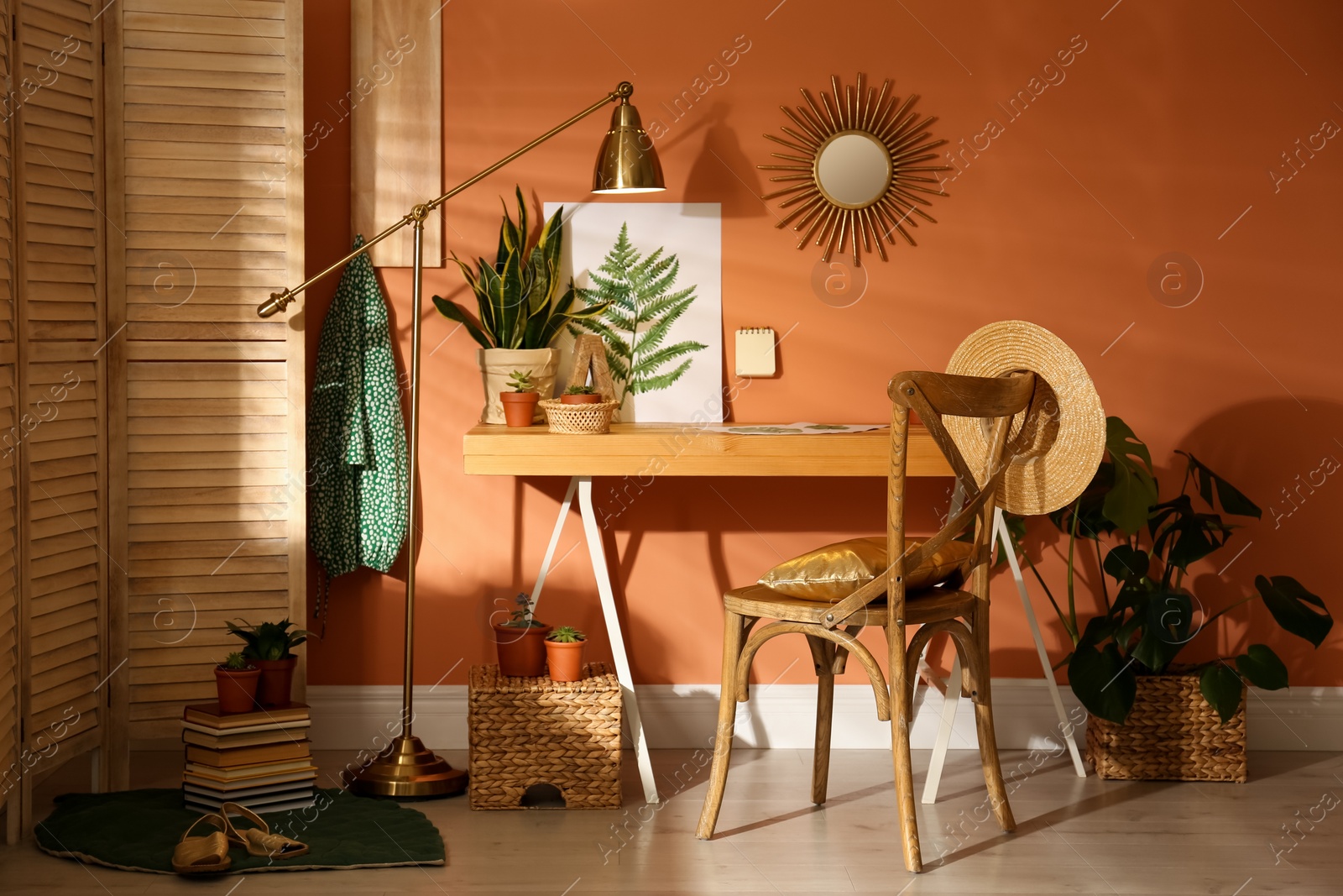 Photo of Beautiful room interior with wooden table near brown wall