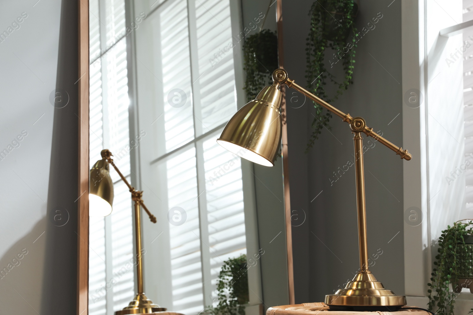 Photo of Room interior with stylish lamp and mirror