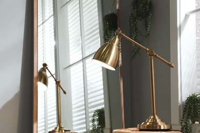 Photo of Room interior with stylish lamp and mirror