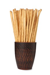 Delicious grissini sticks in cup on white background