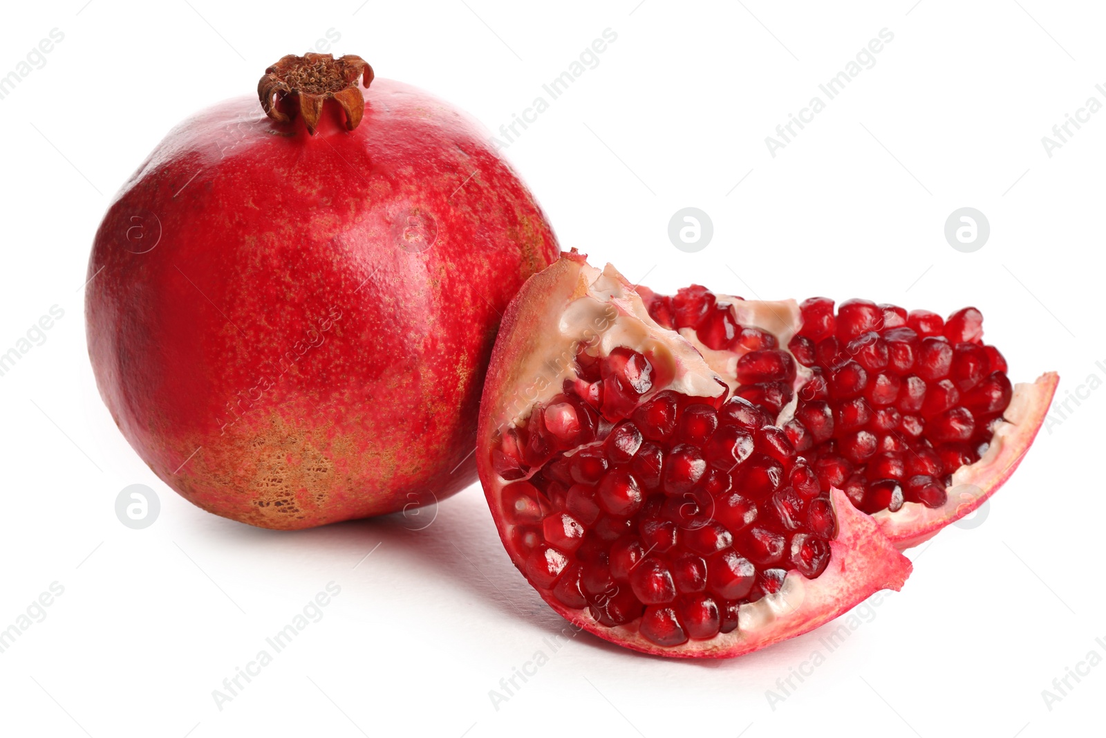 Photo of Ripe pomegranates on white background. Delicious fruits