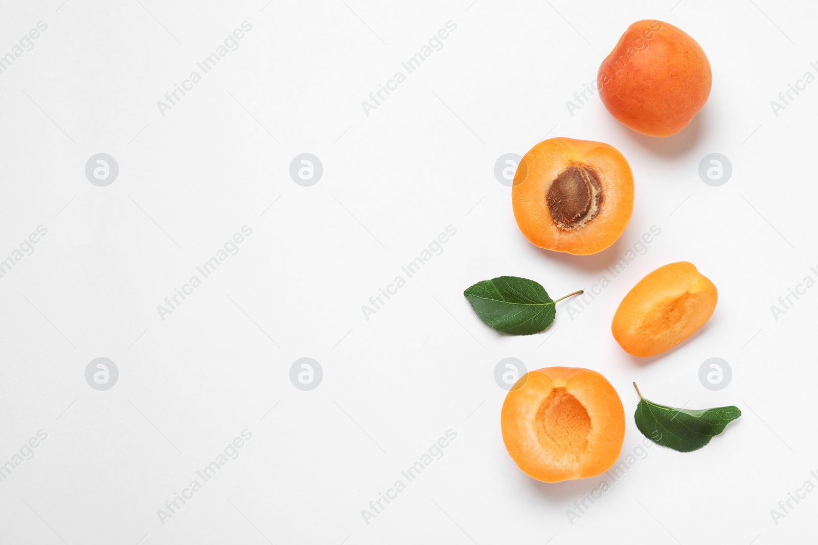 Photo of Delicious ripe sweet apricots on white background, top view