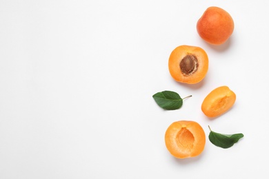 Photo of Delicious ripe sweet apricots on white background, top view