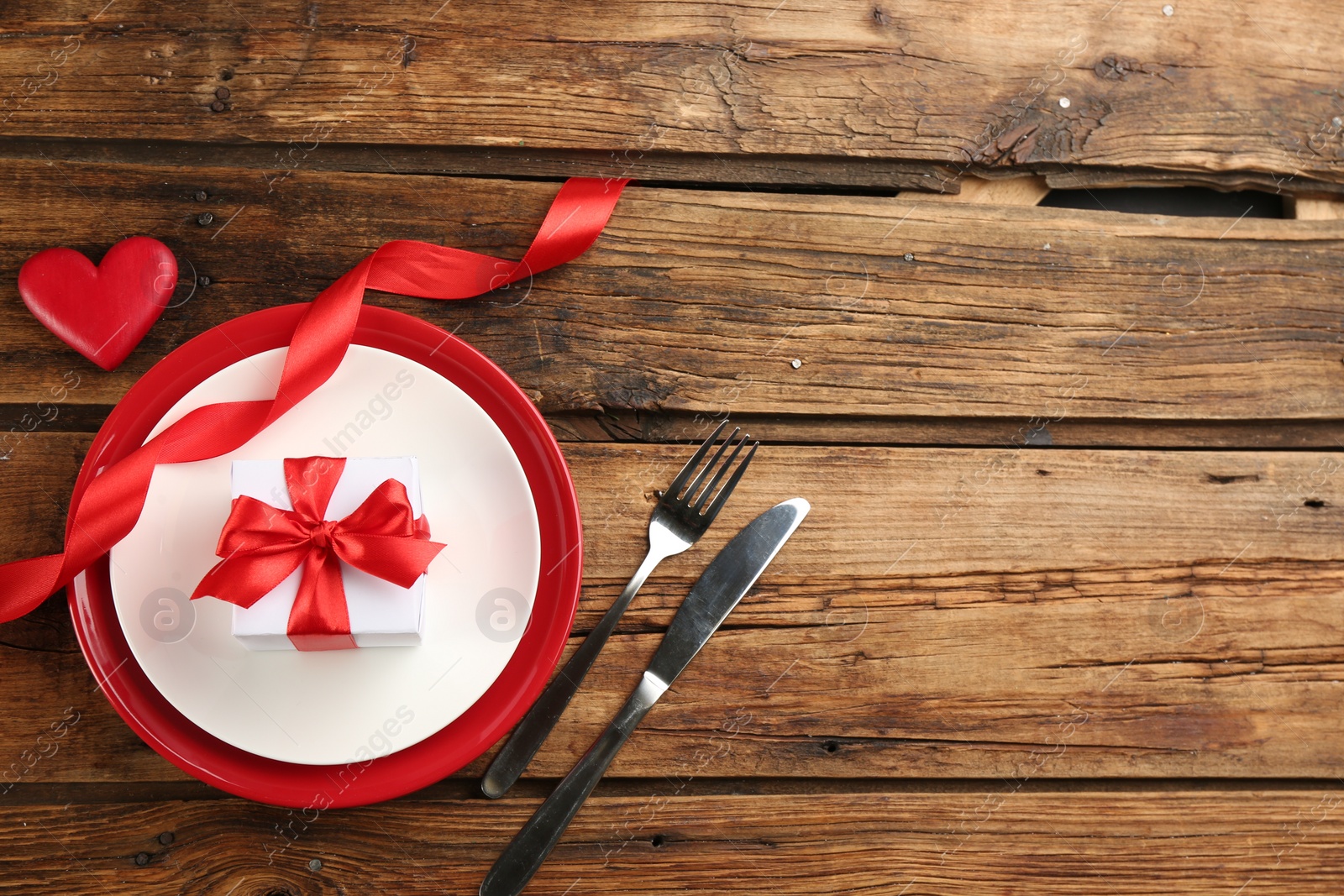 Photo of Beautiful table setting on wooden background, flat lay with space for text. Valentine's Day dinner