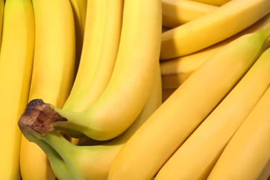 Photo of Closeup view of ripe yellow bananas as background