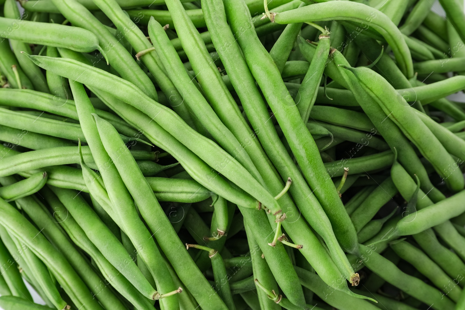 Photo of Many fresh green beans as background, closeup