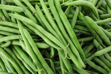 Photo of Many fresh green beans as background, closeup