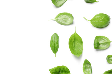 Photo of Fresh green basil leaves on white background, top view