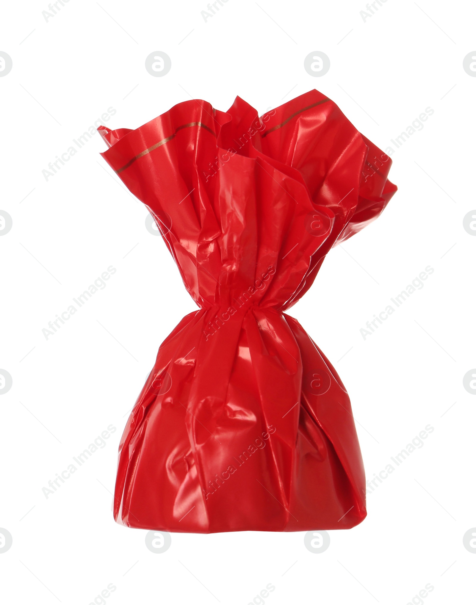 Photo of Delicious candy in red wrapper isolated on white