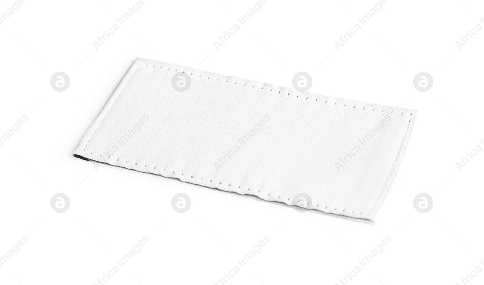 Photo of Blank stylish clothing label isolated on white