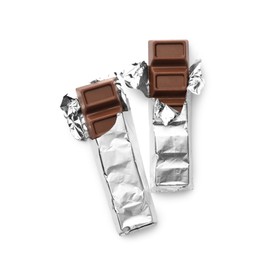 Photo of Delicious sweet chocolate bars on white background, top view