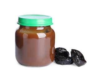 Jar with healthy baby food and dried plums on white background