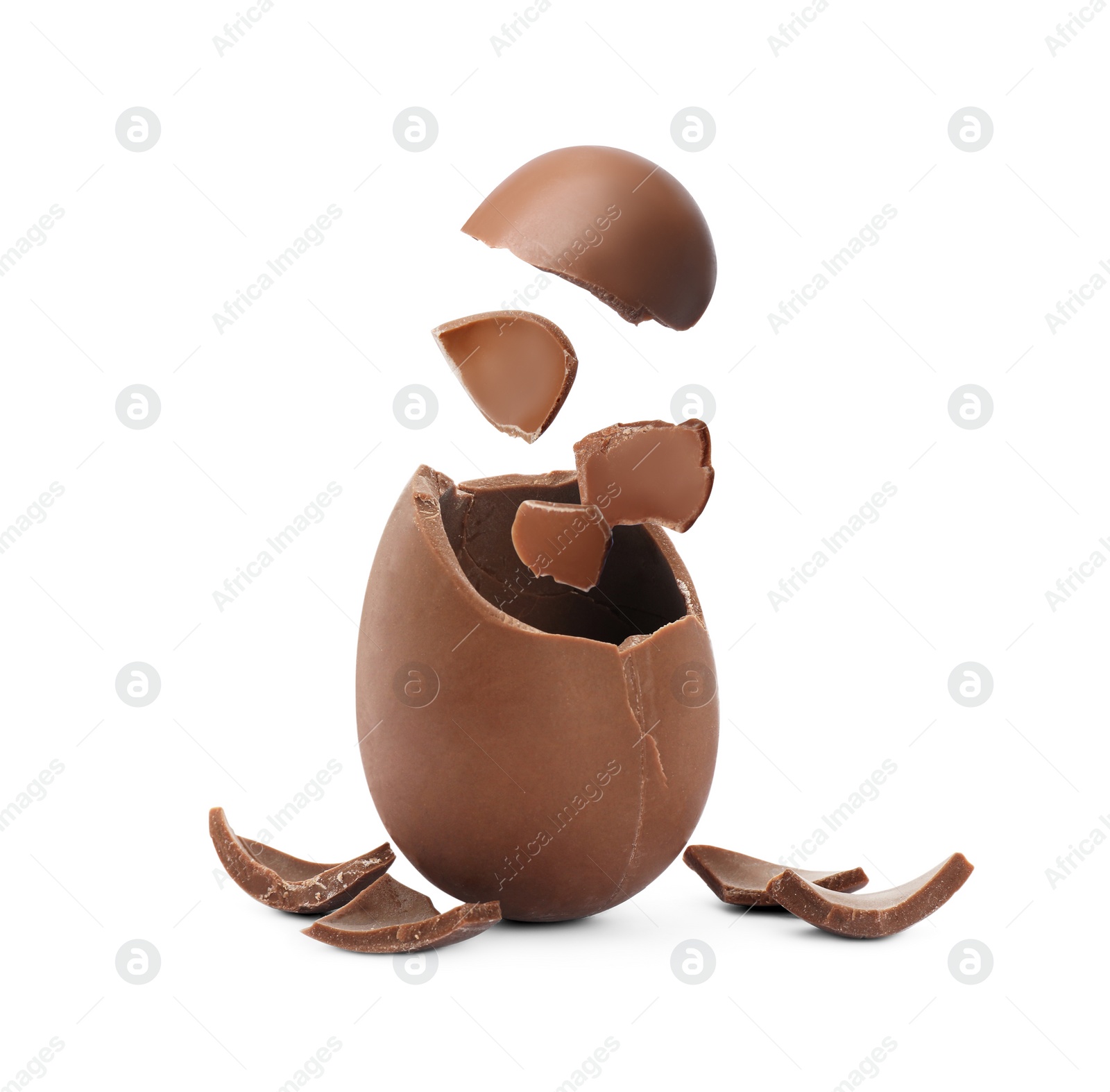 Image of Exploded milk chocolate egg on white background