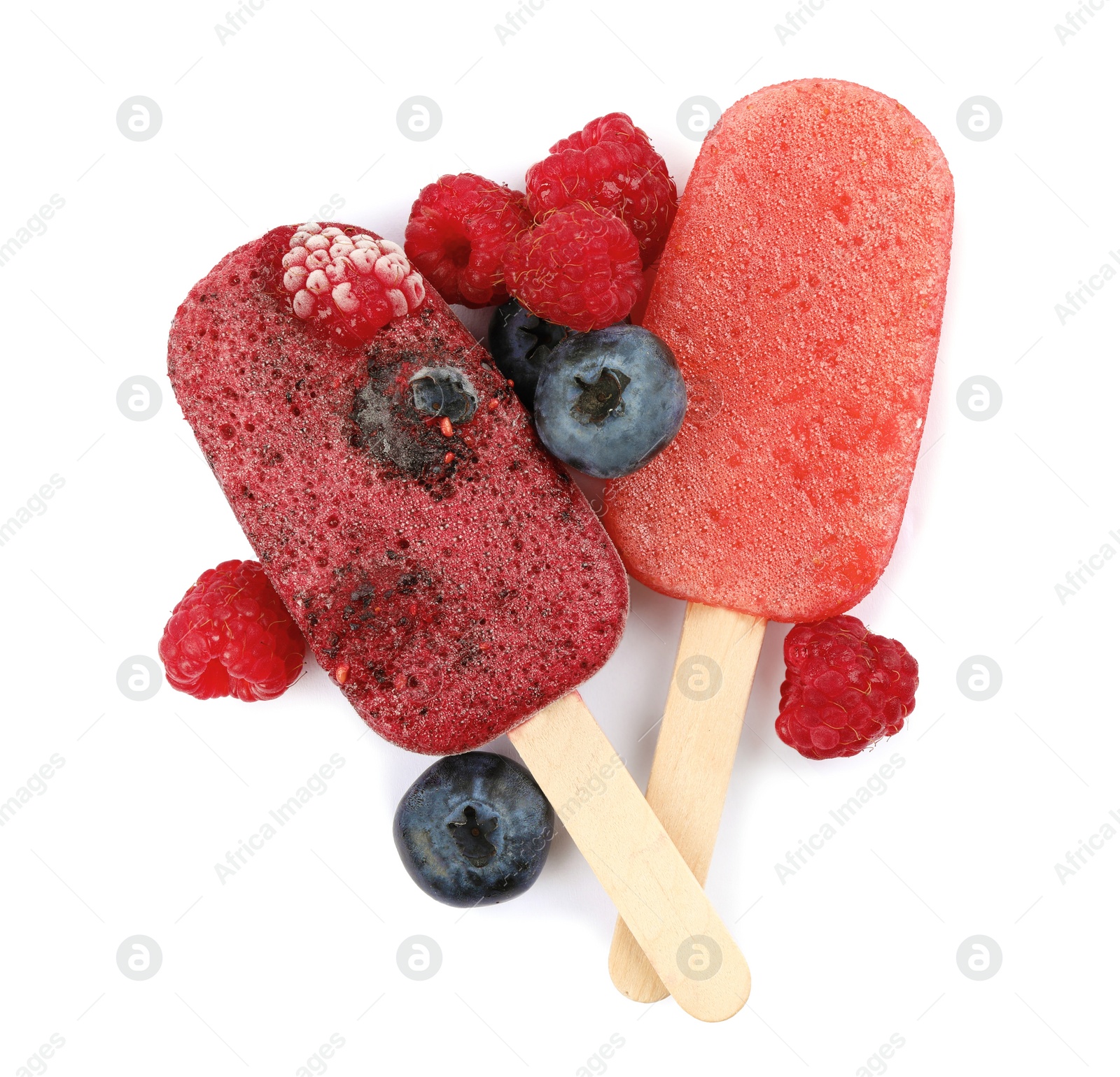 Photo of Tasty berry ice pops isolated on white, top view. Fruit popsicle