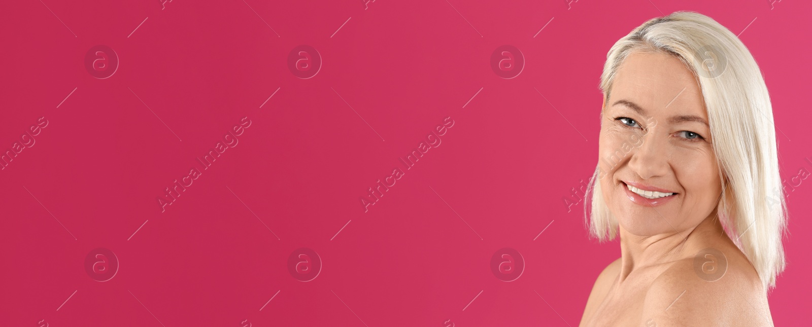 Image of Portrait of beautiful mature woman on pink background, space for text. Banner design