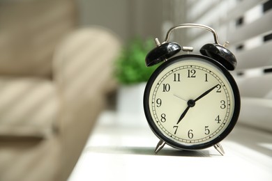 Photo of Alarm clock on windowsill, space for text. Morning time