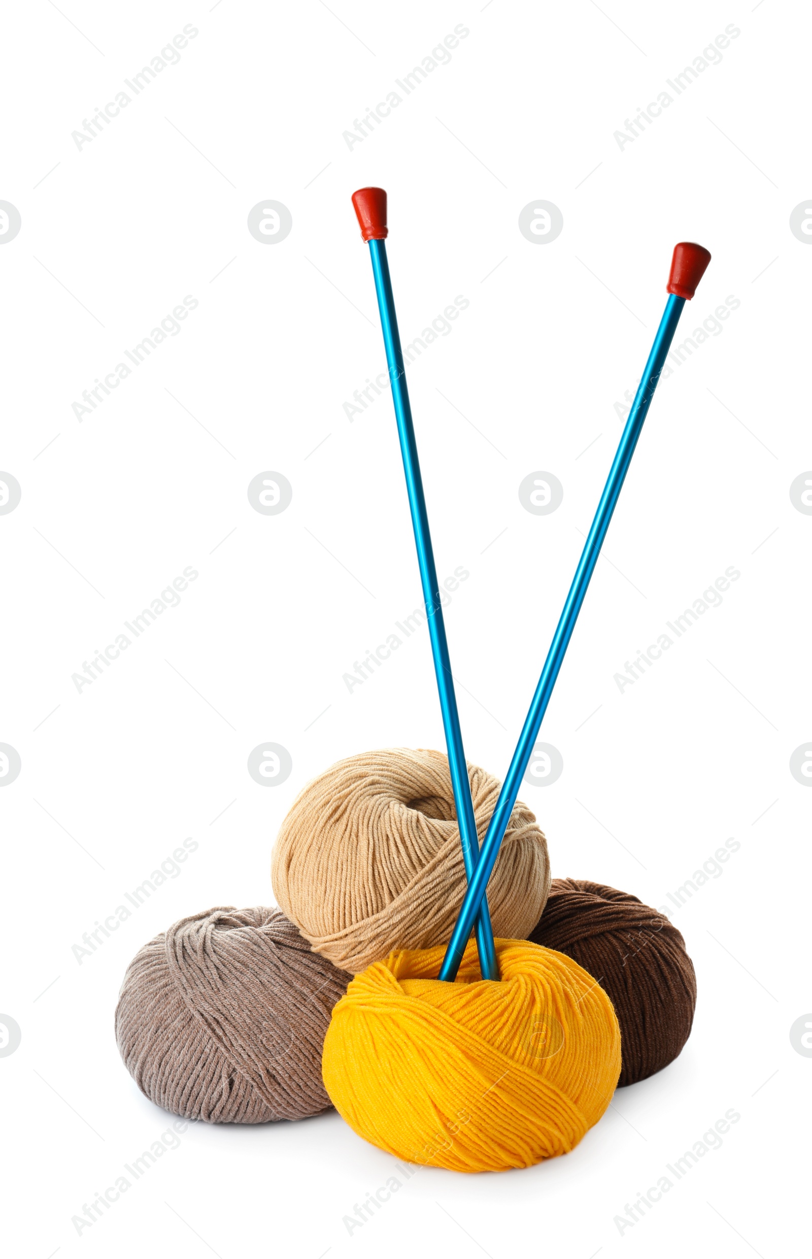 Photo of Soft woolen yarns and knitting needles on white background