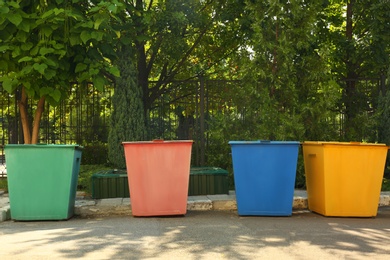 Recycling bins for different types of garbage outdoors