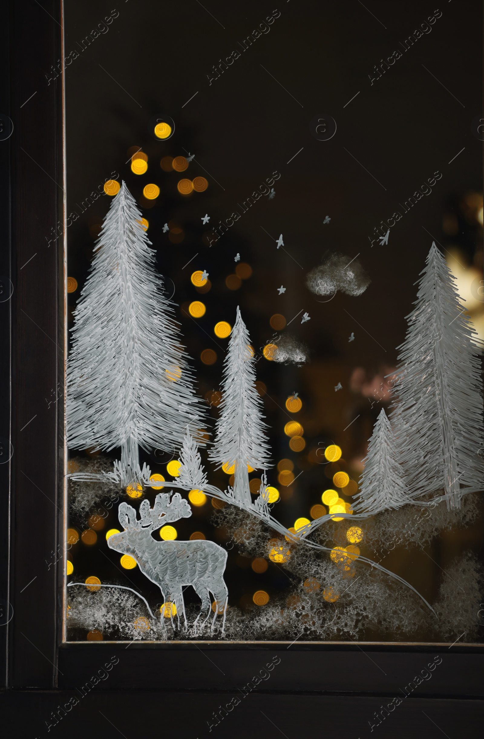 Photo of Beautiful drawing made with artificial snow on window. Christmas decor