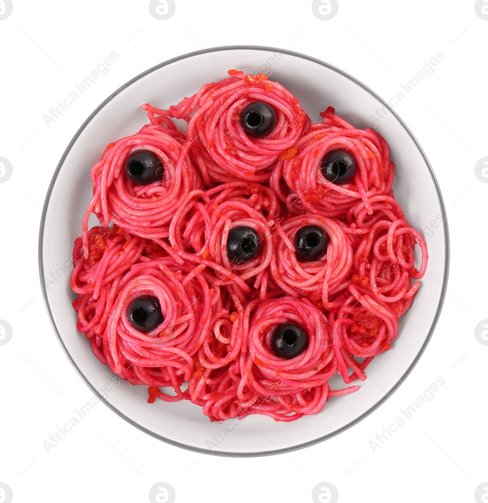 Photo of Red pasta with olives in bowl isolated on white, top view. Halloween food