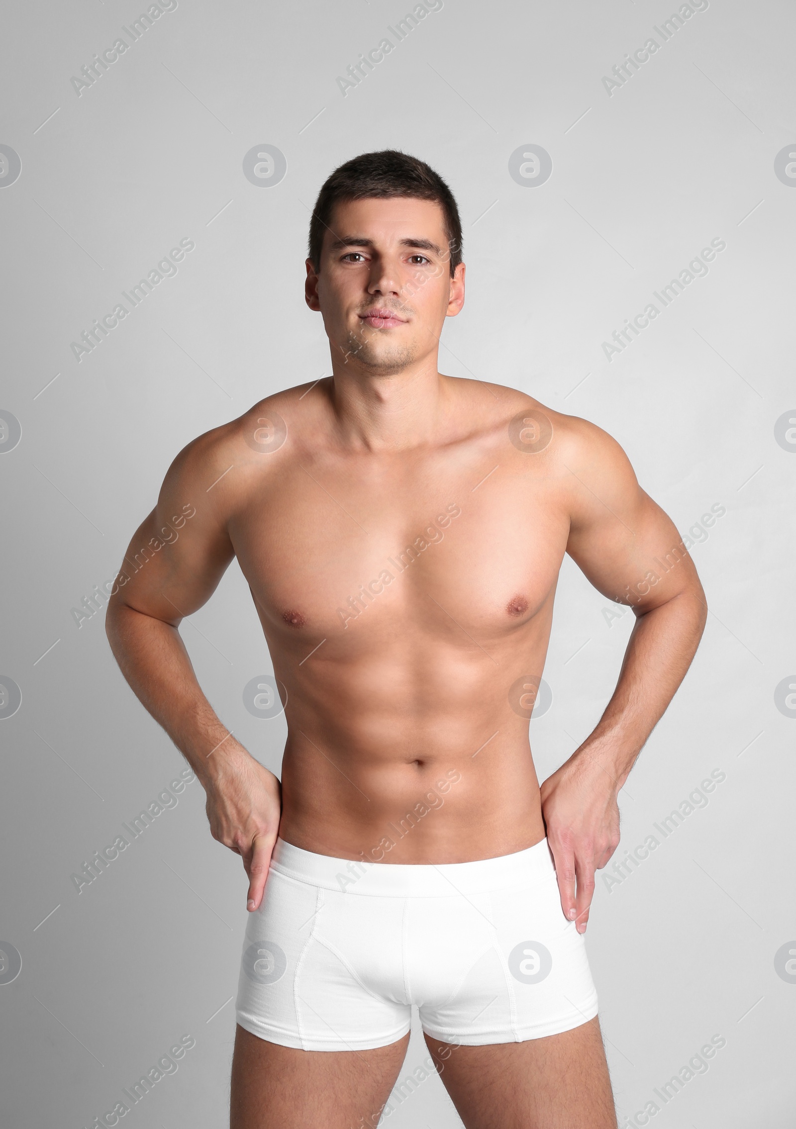 Photo of Man with sexy body on light background