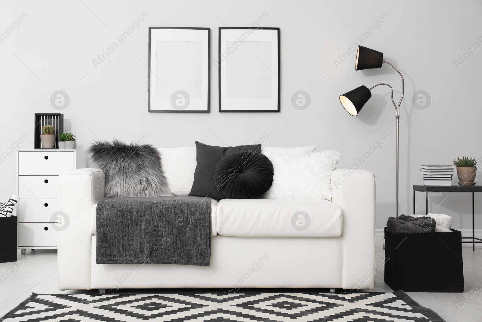 Photo of Elegant white sofa in modern living room interior