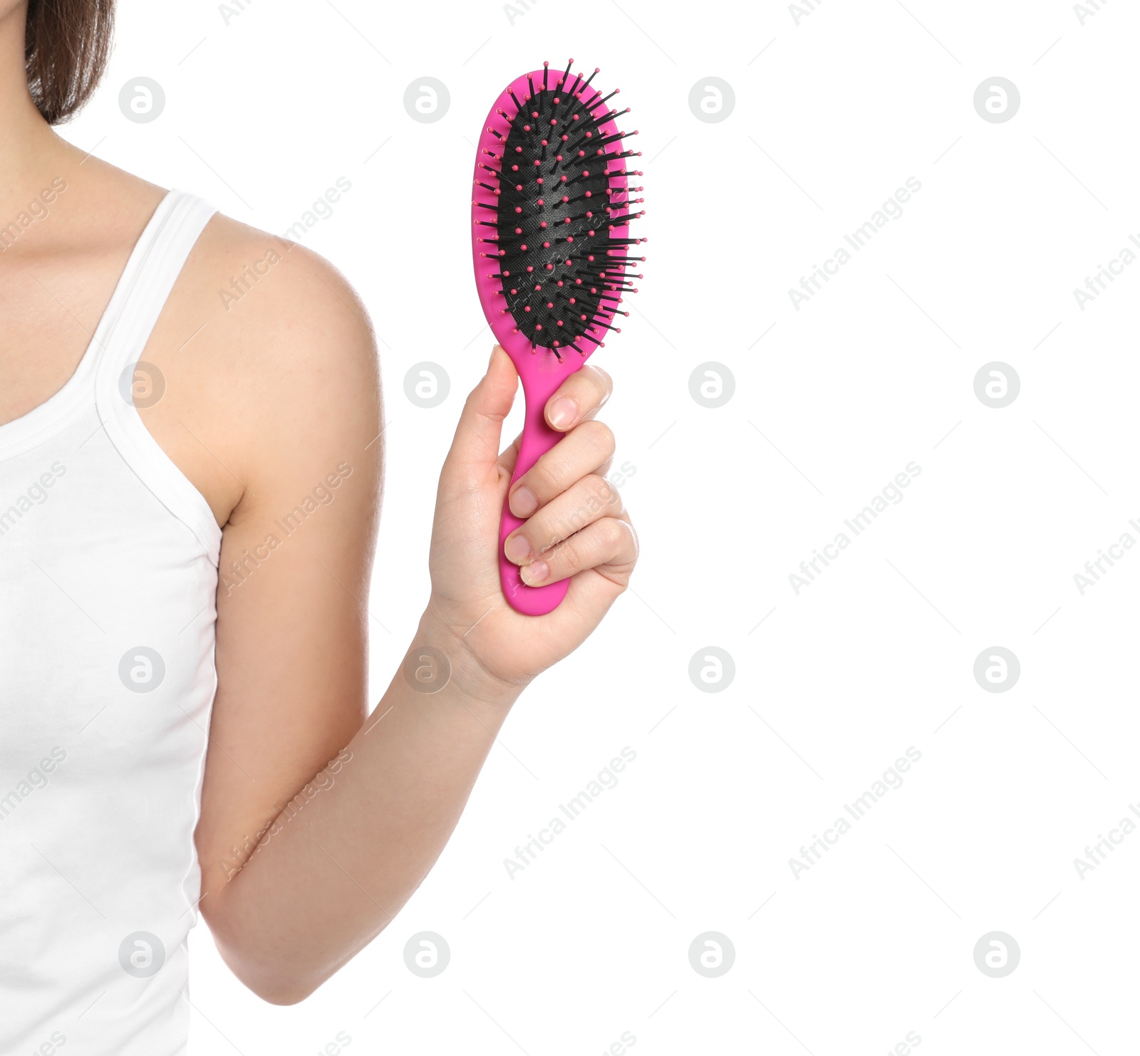 Photo of Woman holding hair brush on white background, closeup