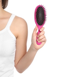 Photo of Woman holding hair brush on white background, closeup