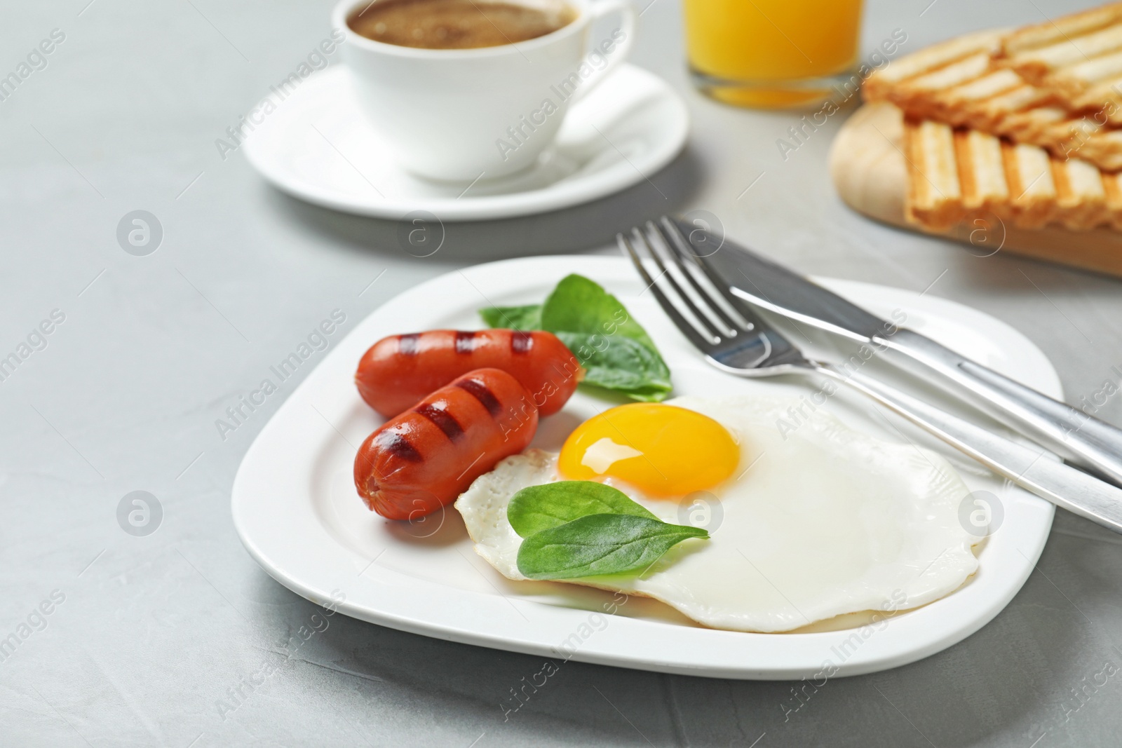 Photo of Delicious breakfast with fried egg served on table