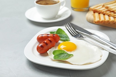 Photo of Delicious breakfast with fried egg served on table