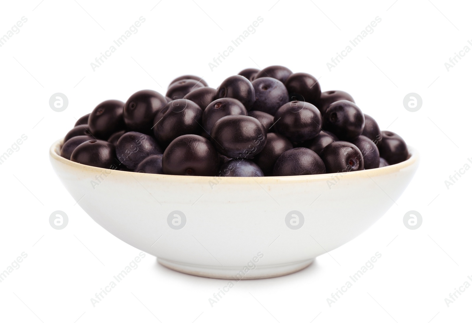 Photo of Ceramic plate with fresh acai berries on white background