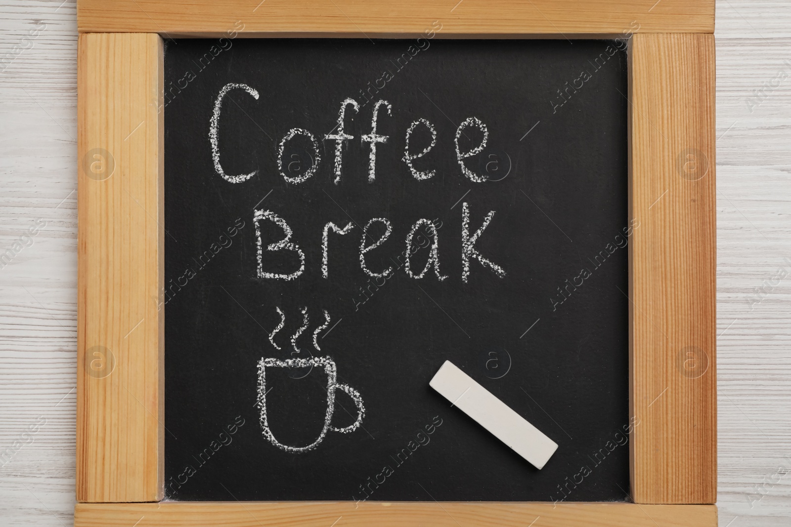 Photo of Blackboard with phrase Coffee Break and piece of chalk on white wooden table, top view