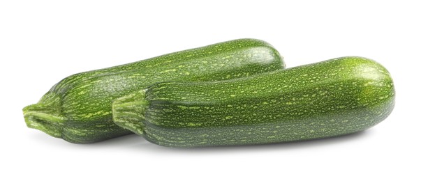 Photo of Fresh raw ripe zucchinis on white background