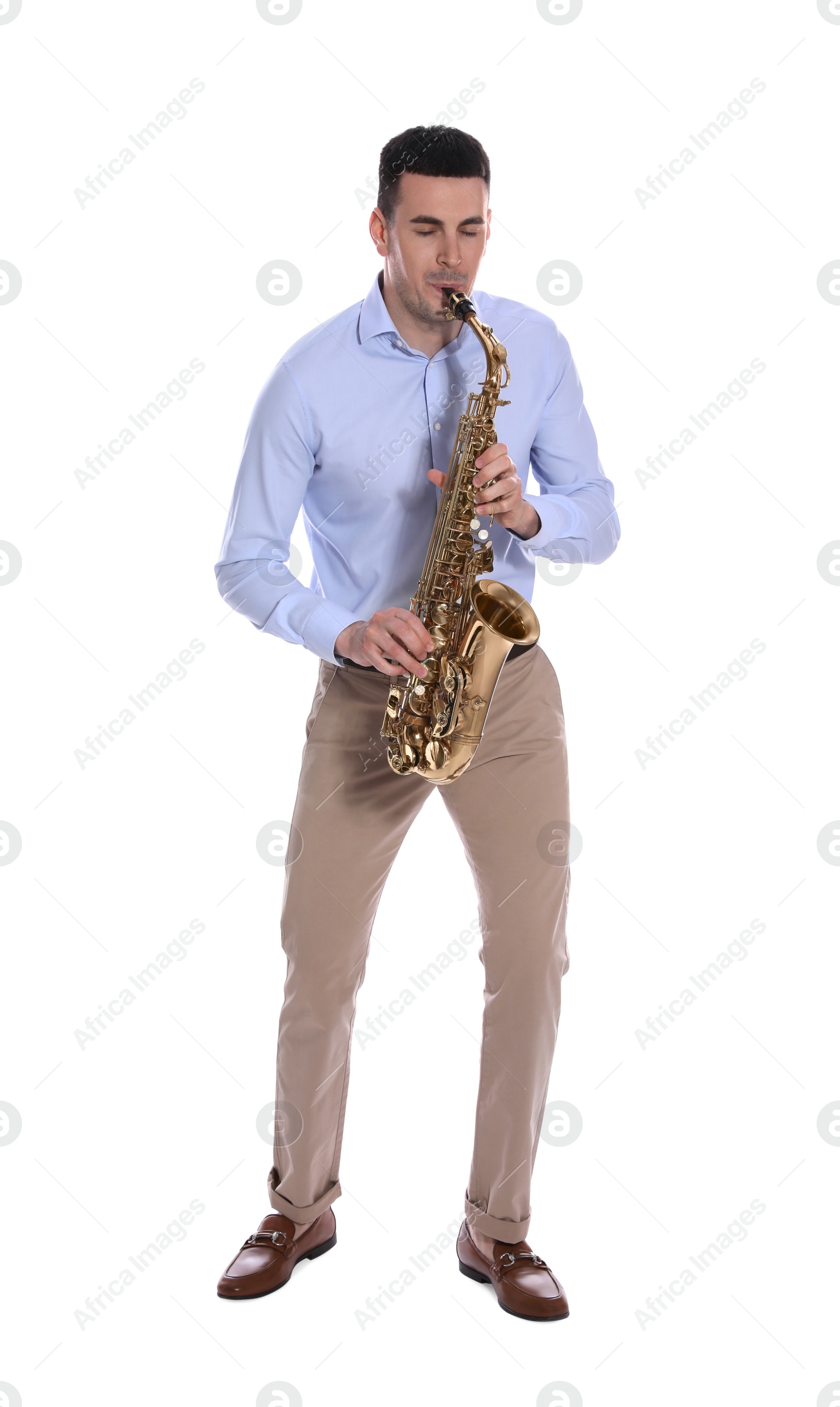 Photo of Young man playing saxophone on white background