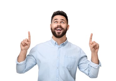 Photo of Happy young man with mustache pointing at something on white background