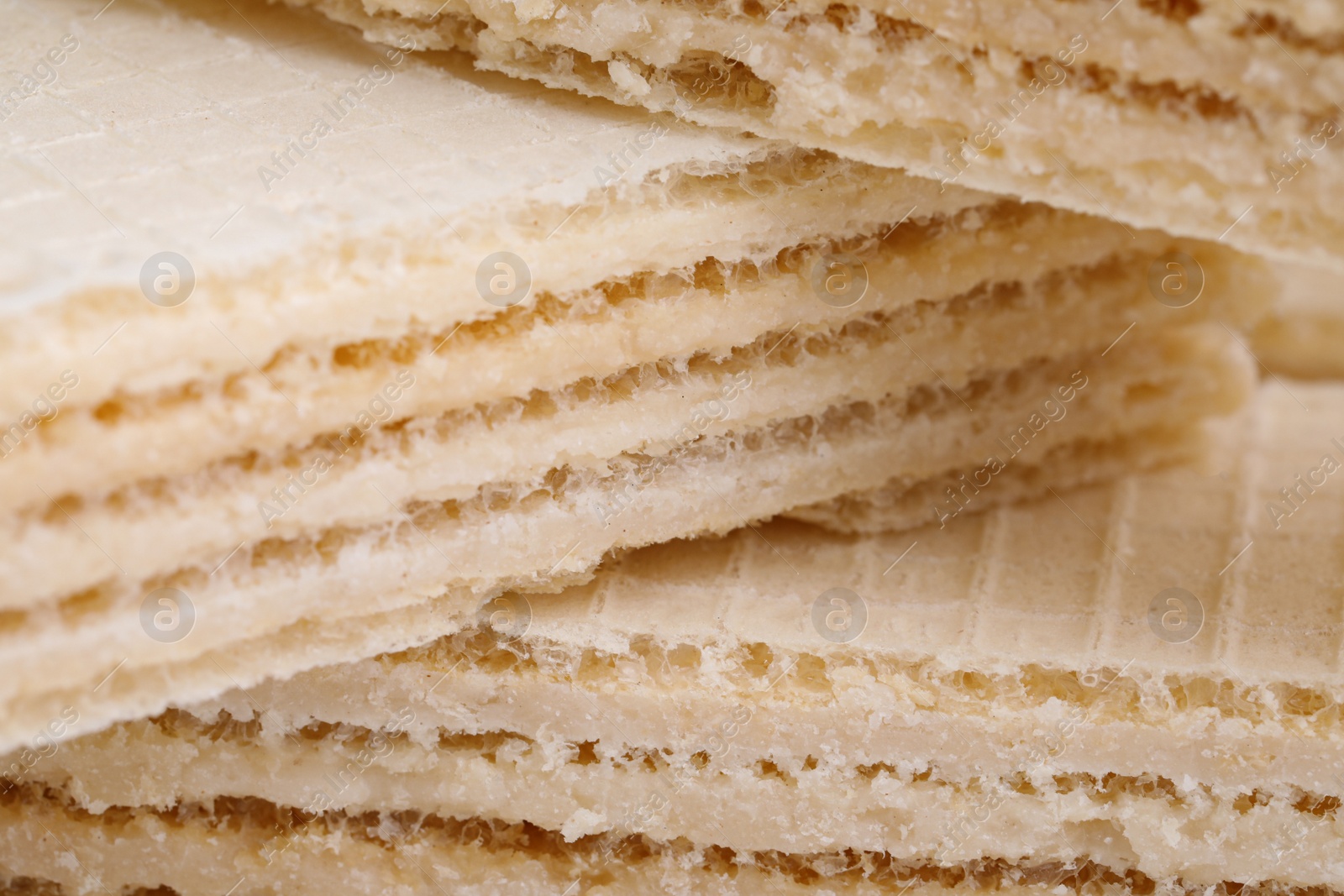 Photo of Delicious crispy wafers as background, closeup view