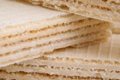 Photo of Delicious crispy wafers as background, closeup view