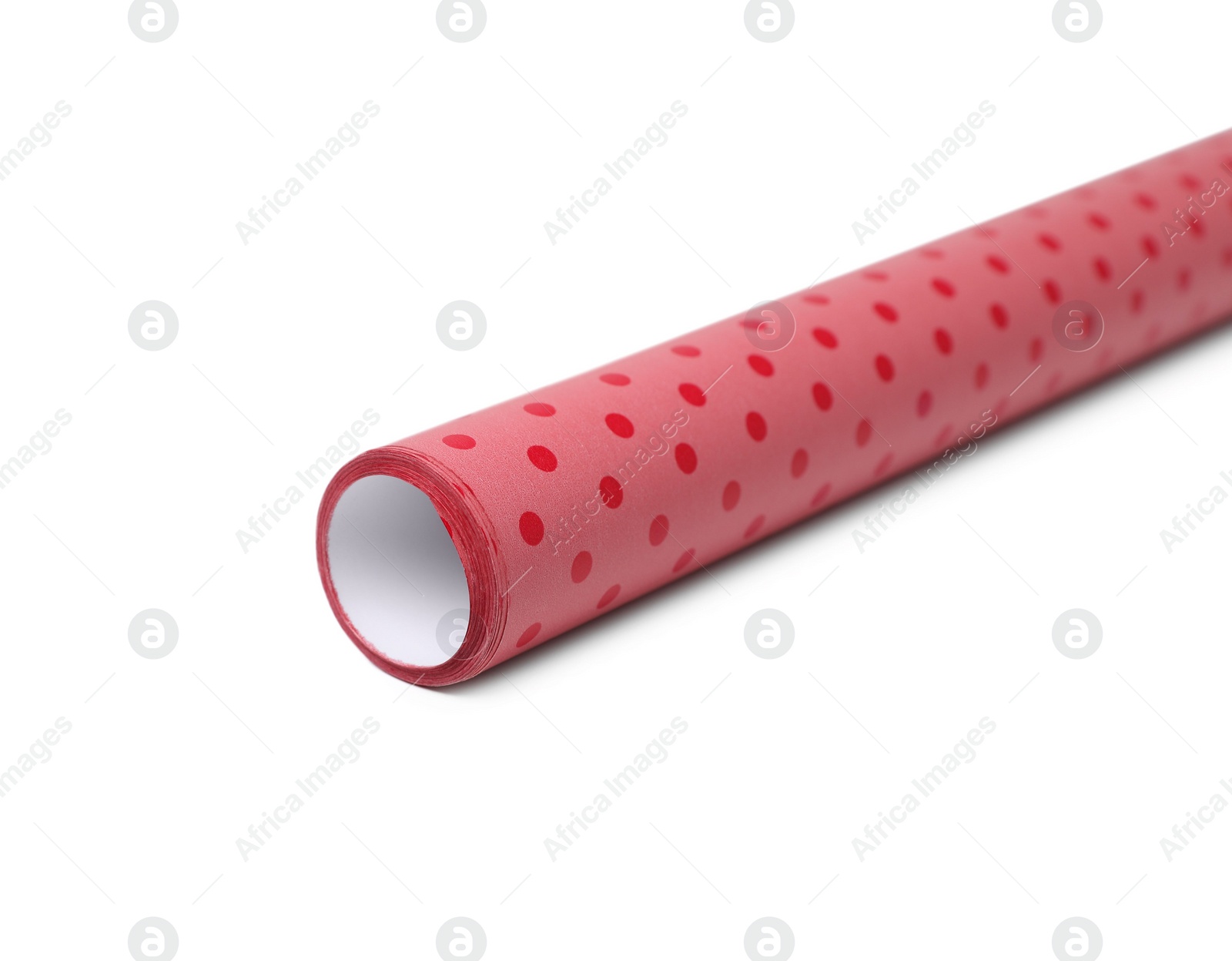 Photo of Roll of polka dot wrapping paper on white background