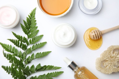 Photo of Flat lay composition with different body care products on white background