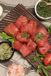 Raw beef meat and different ingredients for cooking delicious goulash on table, flat lay