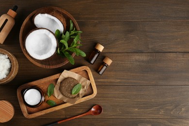 Photo of Flat lay composition with homemade cosmetic products and fresh ingredients on wooden table. Space for text