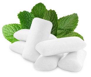 Menthol chewing gum pillows and mint leaves on white background