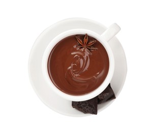 Cups of delicious hot chocolate with anise star on white background, top view