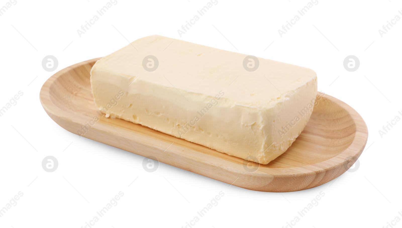 Photo of Block of tasty butter with wooden dish isolated on white