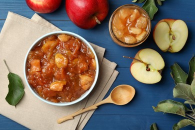 Photo of Tasty apple jam and fresh fruits on blue wooden table, flat lay